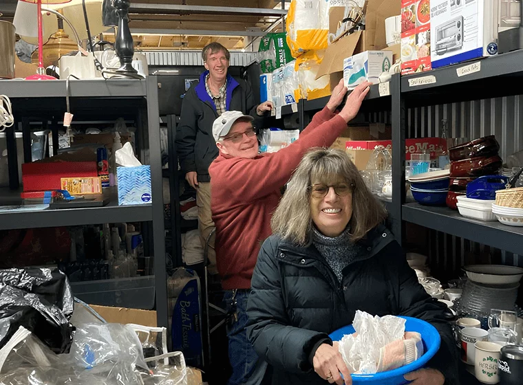volunteers gathering supplies from food pantry