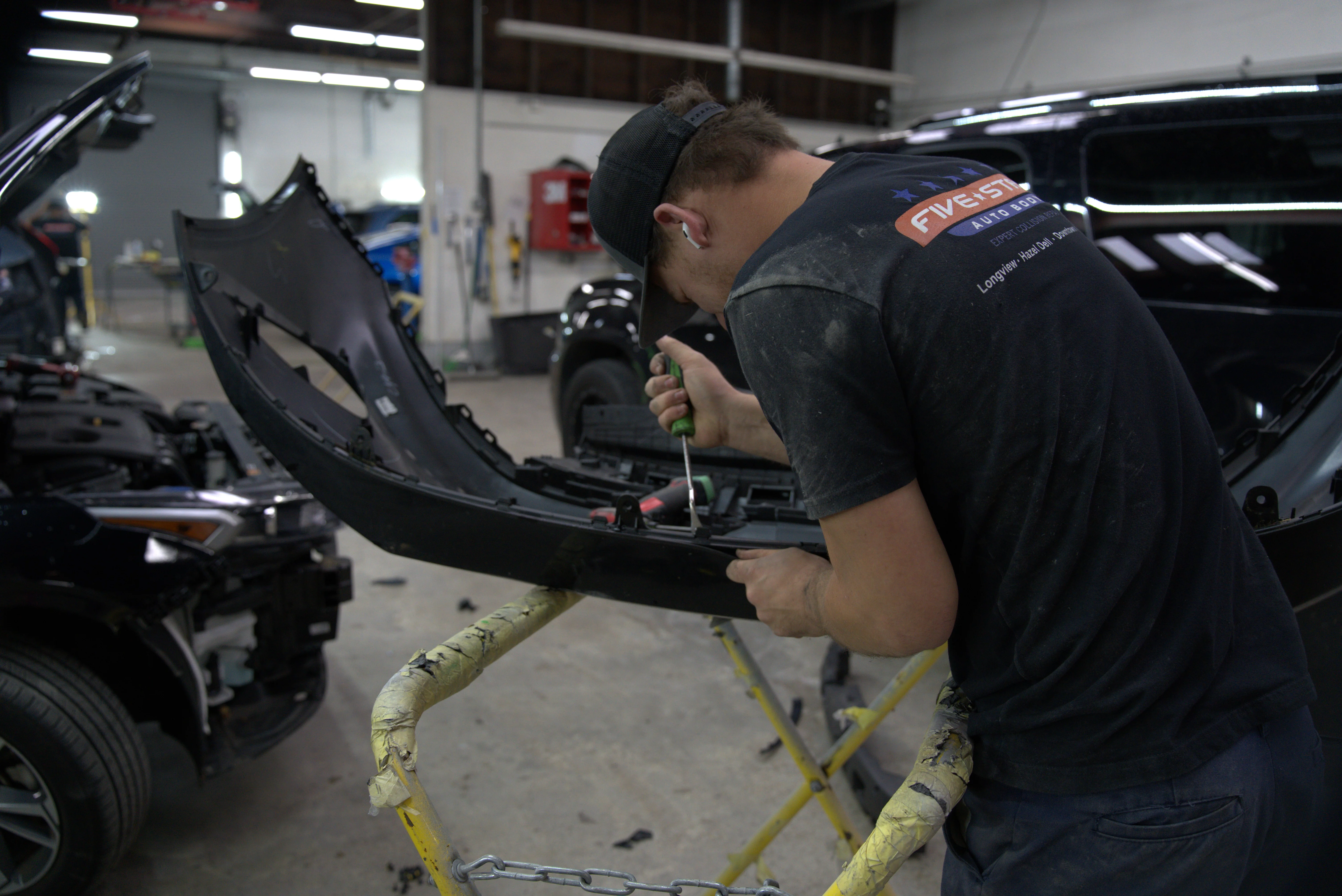 Professional paintless dent repair technician at Five Star Auto Body