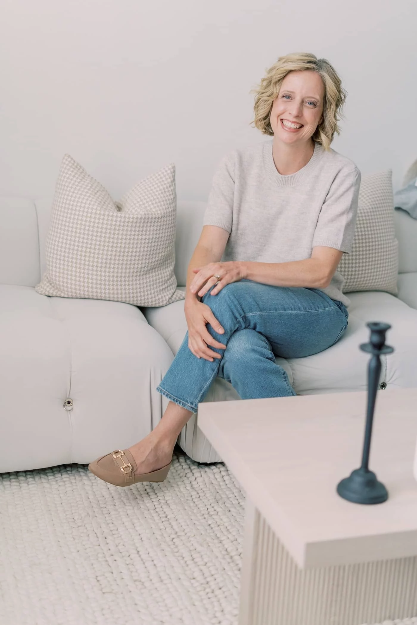 Nancy Wall sitting on a couch