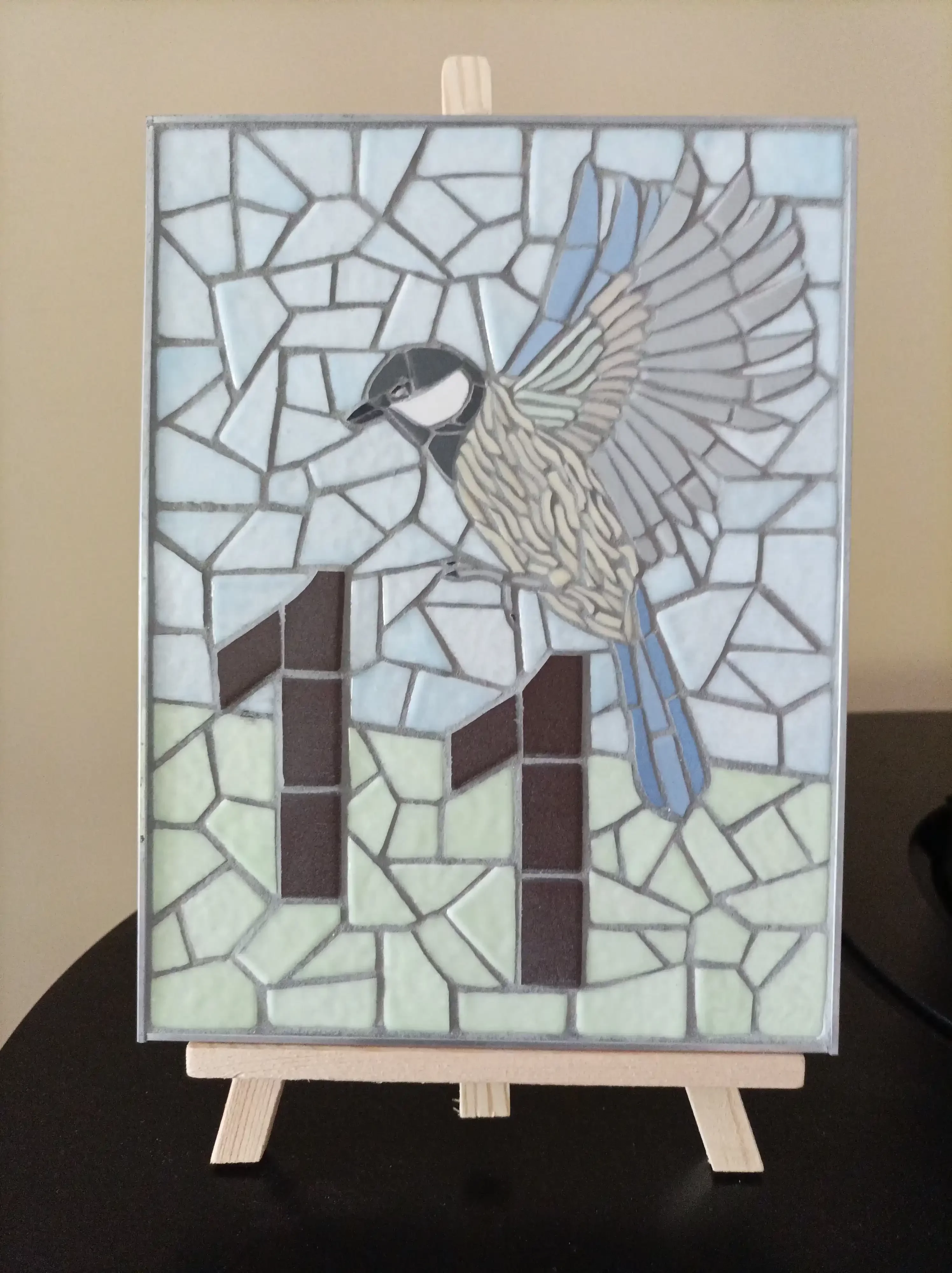 Mosaïque d'une mésange charbonnière pour un numéro de porte