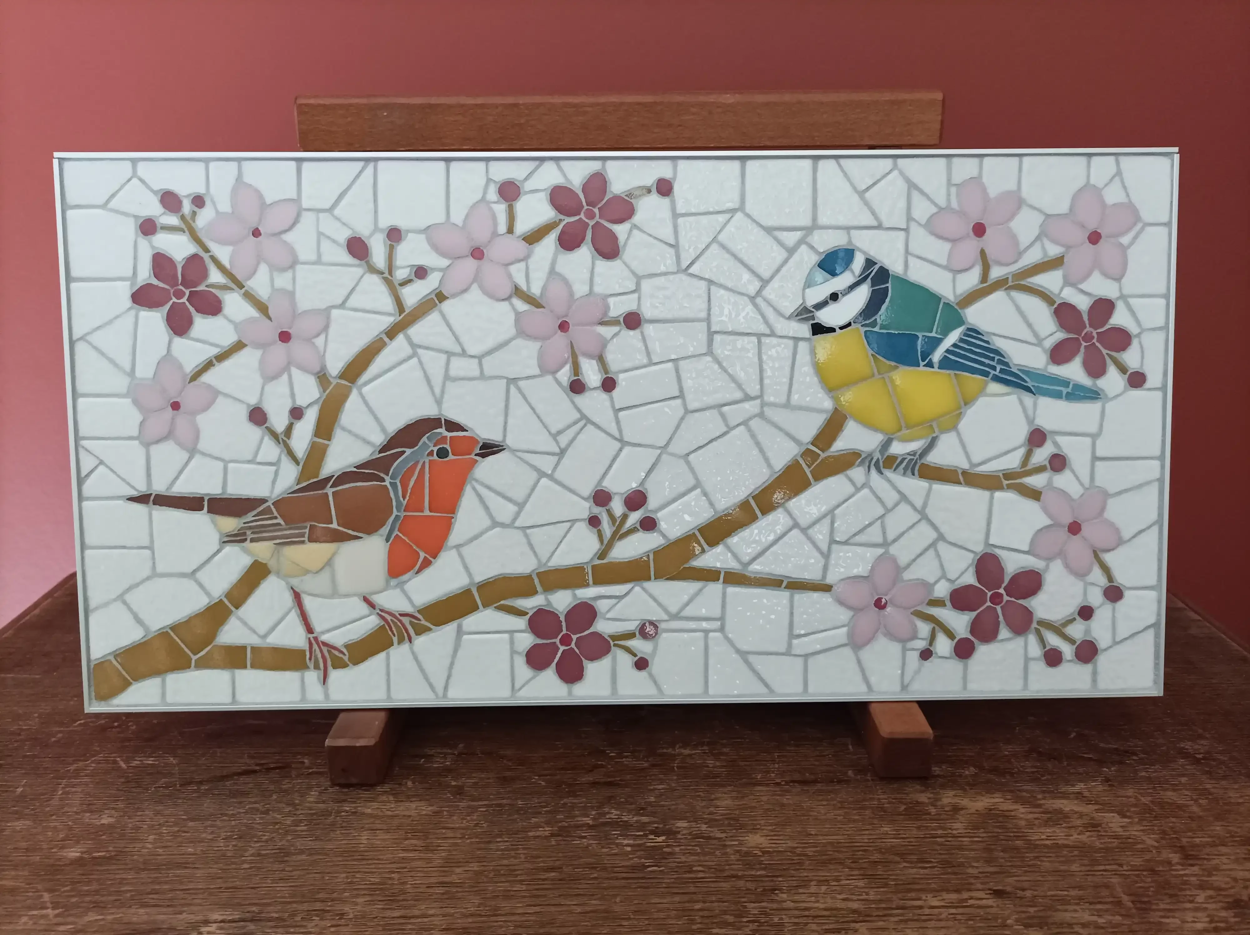 Mosaïque d'un rouge gorge et d'une mésange bleue