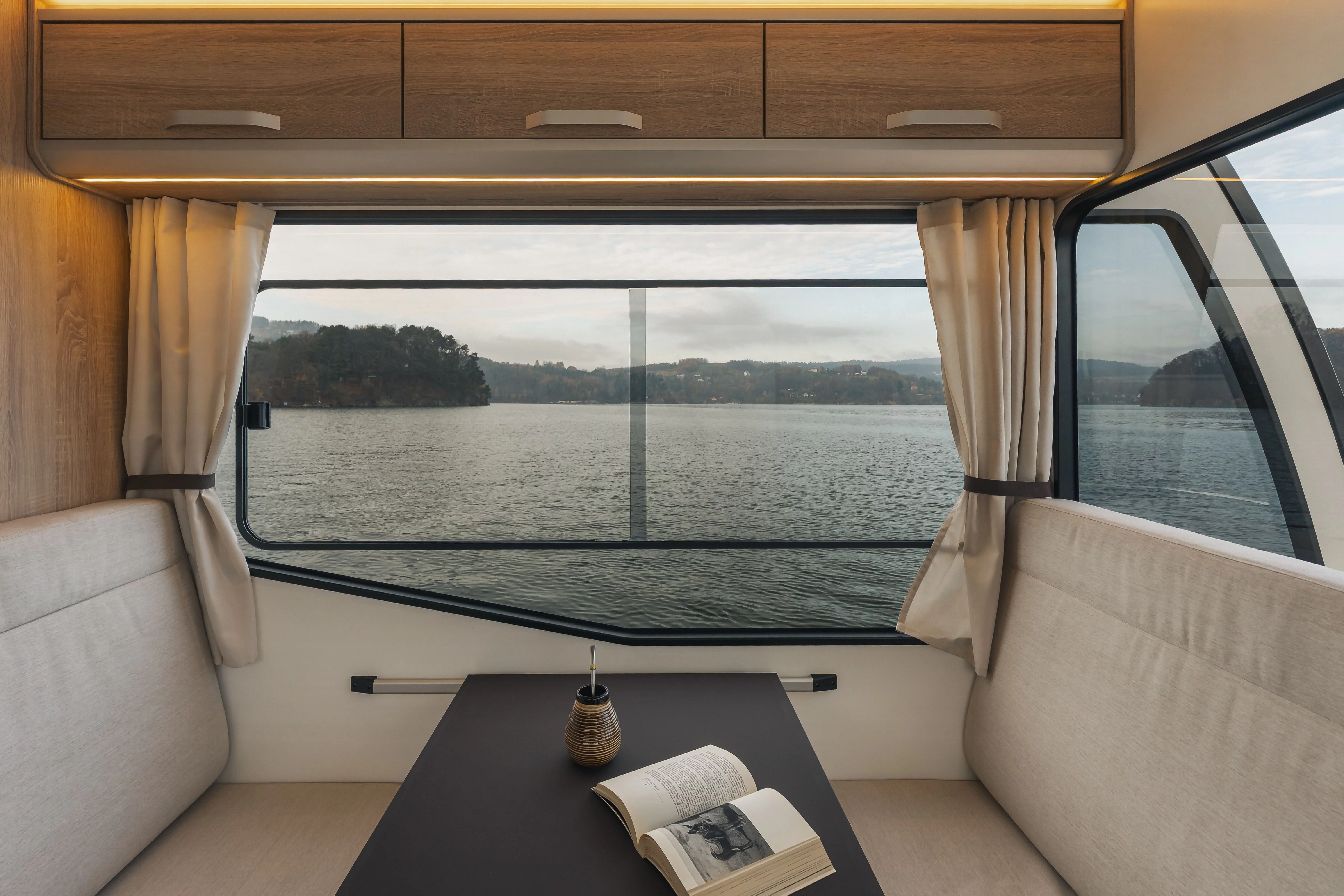 brown wooden house on water