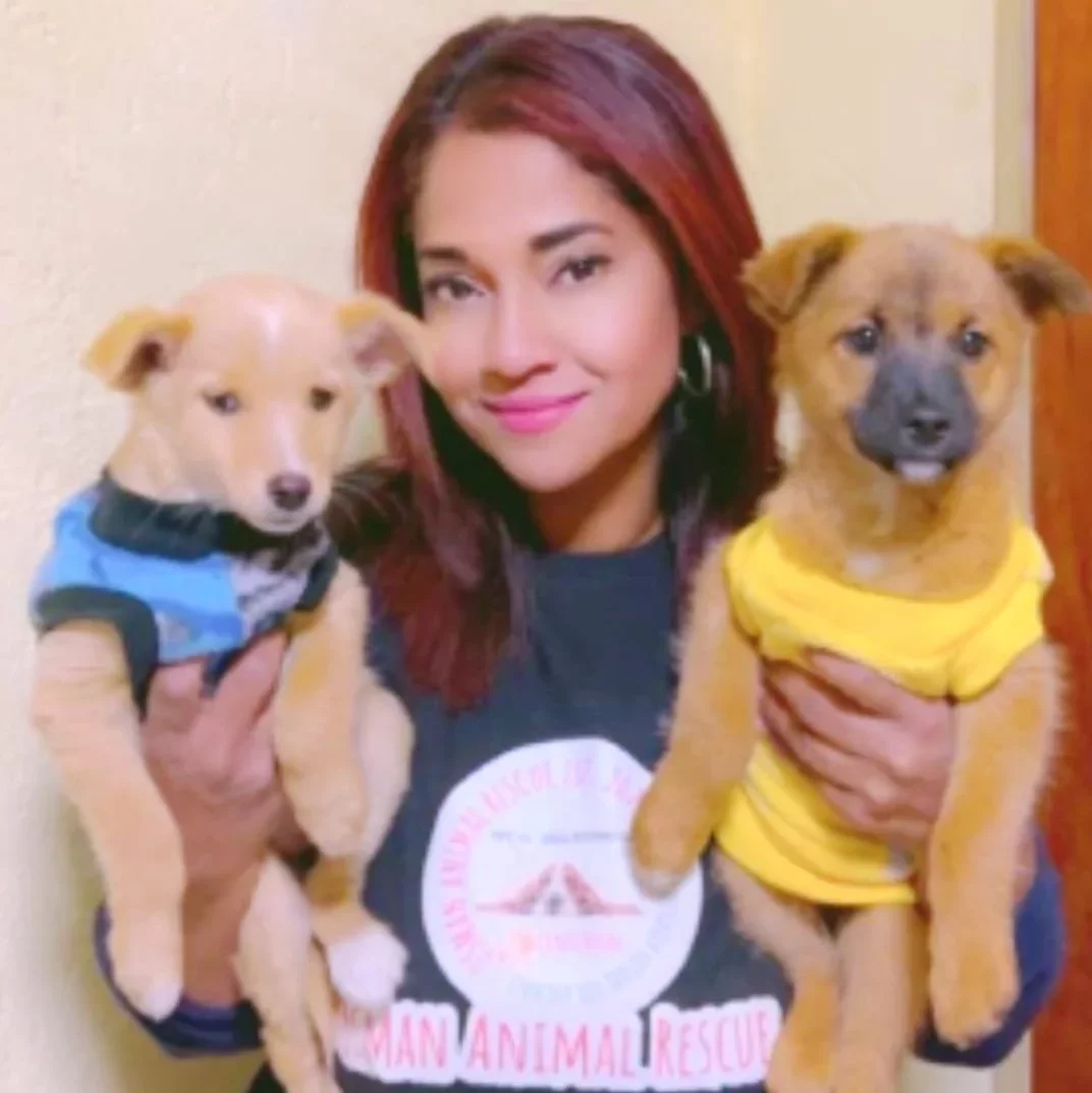 Images of the team members described in each card. You can see their faces and they are holding a pet from the shelter. Only Jade does not have her image on the website and the information card has an information icon as it's placeholder image.