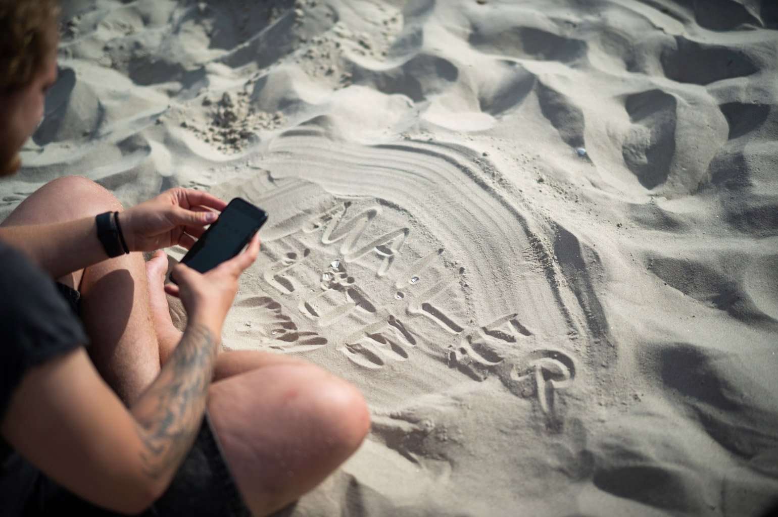 MailerLite written in the sand by employee.